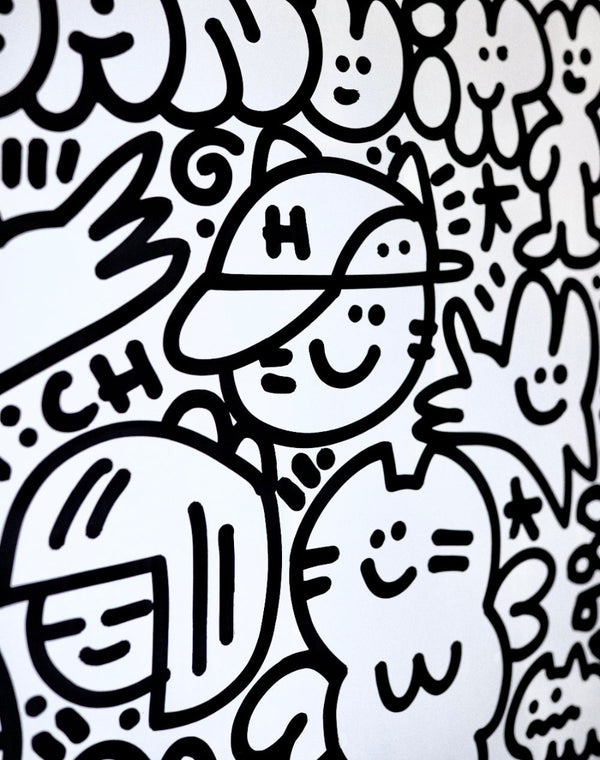 Détail d'une peinture de l'artiste CHANOIR, aux couleurs noir et blanc, représentant un univers graphique ludique et peuplé de personnages félins et souriants, typiques du style street art de l’artiste.